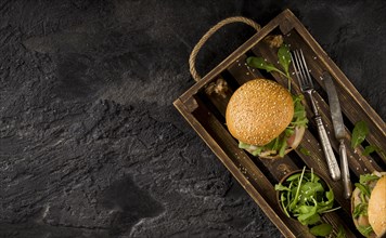 Top view burgers basket with copy space