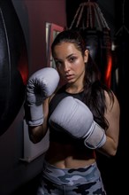 Boxer girl posing gym