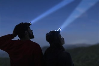 Man woman with head lights