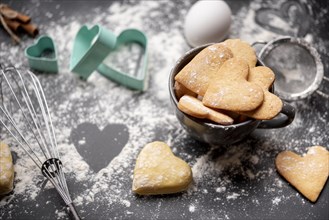 Valentines day cookies with flour kitchen utensils