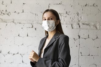 Portrait woman office with face mask