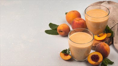 High angle milkshake glasses with peaches copy space