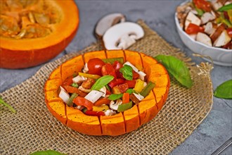 Vegan baked Red kuri squash vegetable filled with bell pepper