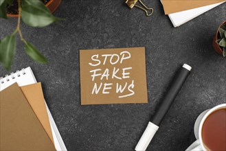Top view stop fake news concept