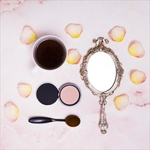 Coffee cup petals compact powder oval brush compact powder pink background