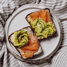 Top view breakfast sandwiches bed with salmon avocado