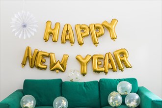 Happy new year inscription from yellow balloons