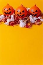 Halloween orange pumpkins on a background of yellow