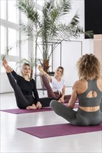 Women practicing yoga together
