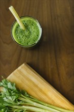 Elevated view fresh green smoothie wooden desk