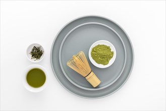 Top view matcha powder with bamboo whisk