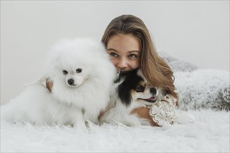 Girl cute white pups sitting bed