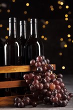 Set wine bottles grapes with bokeh background