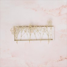 Small flowers branches wooden board table