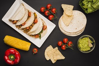 Tacos plate near vegetables sauce