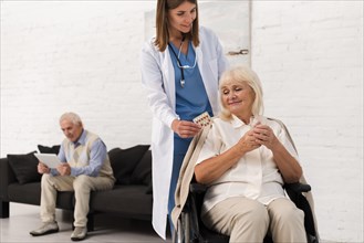 Nurse taking care old woman