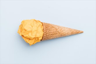 Fake yellow ice cream sugar cone