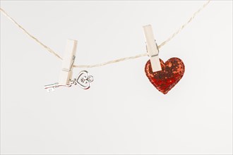 Small heart with key hanging rope