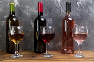 Line wine bottles wineglasses