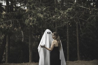 Ghost lady holding hands park