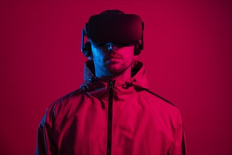 Man wearing virtual reality gadget with red light