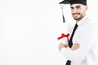 Cheerful man posing with diploma
