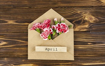 April text envelope with red flowers table