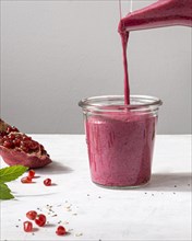 Delicious fruit smoothie with pomegranate