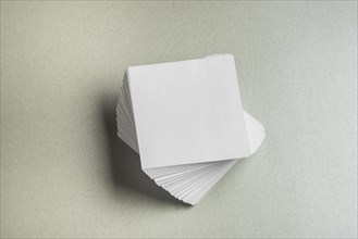 High angle view stacked square shaped paper