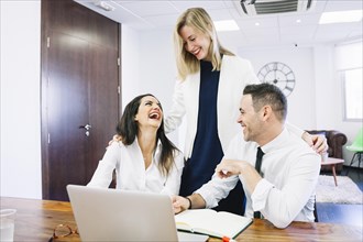 Modern business people laughing
