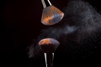 Cosmetic brushes with mist powder dark background