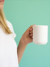 Close up blonde woman with white mug