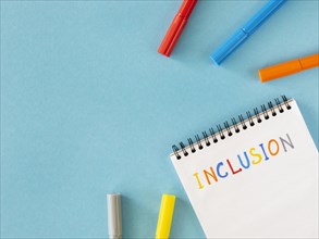 Inclusion word written notebook