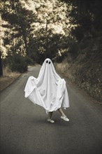 Human ghost suit posing countryside route