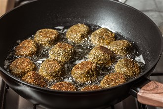 Delicious falafel frying pan high angle