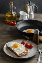 Tasty breakfast with egg bacon high angle