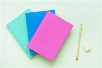 Colorful books with pen eraser