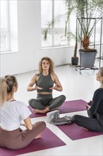 Women doing yoga indoors