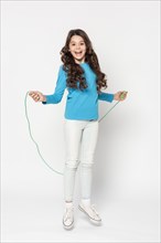 Young girl jumping rope