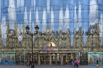 Reflection in the shop window of the exclusive department stores' La Samaritaine