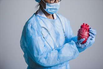Surgeon posing with heart