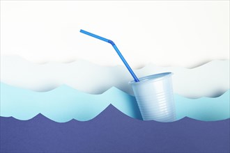 Front view plastic cup with straw paper waves