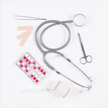 Pill blister pack with stethoscope medical equipments white background