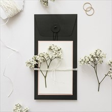 Gypsophila greeting card tied with strings white backdrop