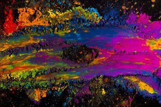 Abstract multicolored holi powder explosion black background
