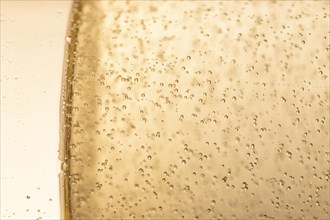 Side view glass with champagne bubbles