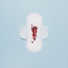 Top view sanitary towel with red sequins