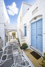 White Cycladic houses with blue doors