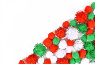 Fluffy round pompons in traditional Christmas colors red