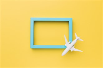 Composition small airplane blue frame